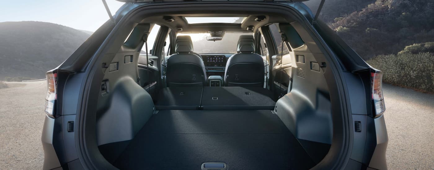 The rear cargo area in a 2025 Kia Sportage X-Pro Prestige for sale.