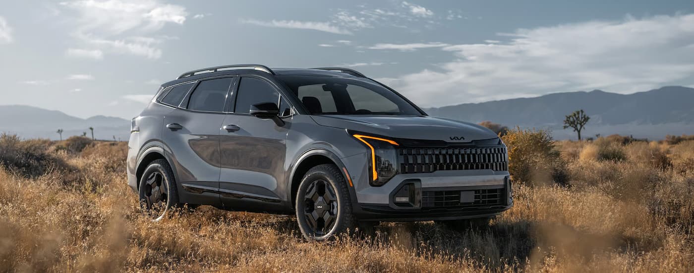 A gray 2026 Kia Sportage parked off-road